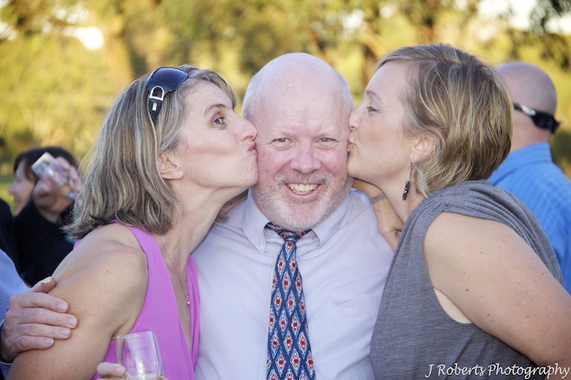 Girls kissing a bloke - wedding photography sydney